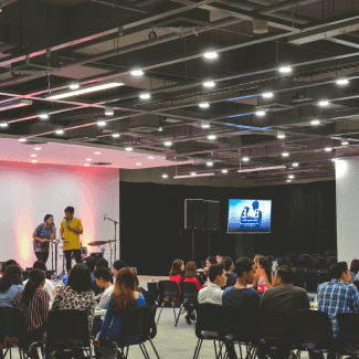Speaker presenting on stage